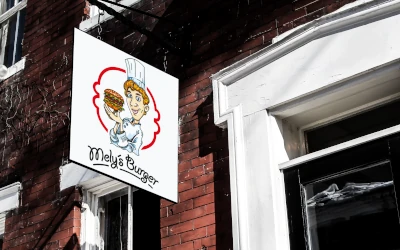 Restaurant-Firmenschild Mellys Burger mit individuell gestaltetem Logo an einer Fassade